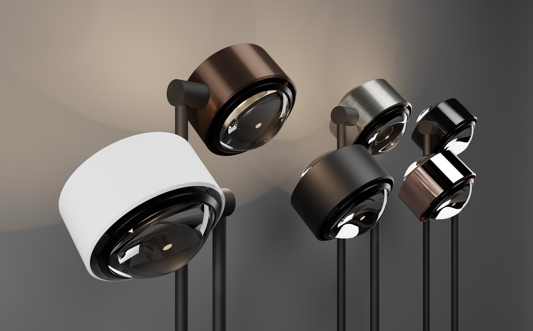 noooko lighting heads shown in a range of considered metal finishes